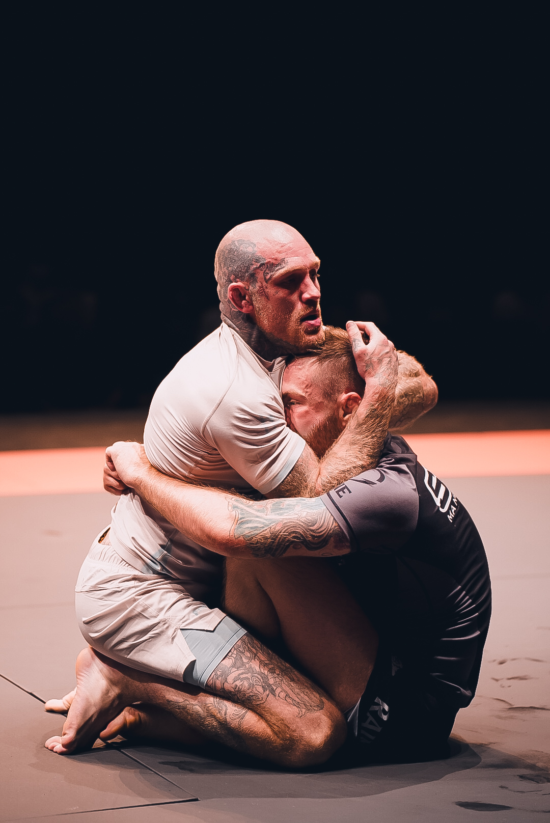 Tight body lock battle on the GrappleMax mat